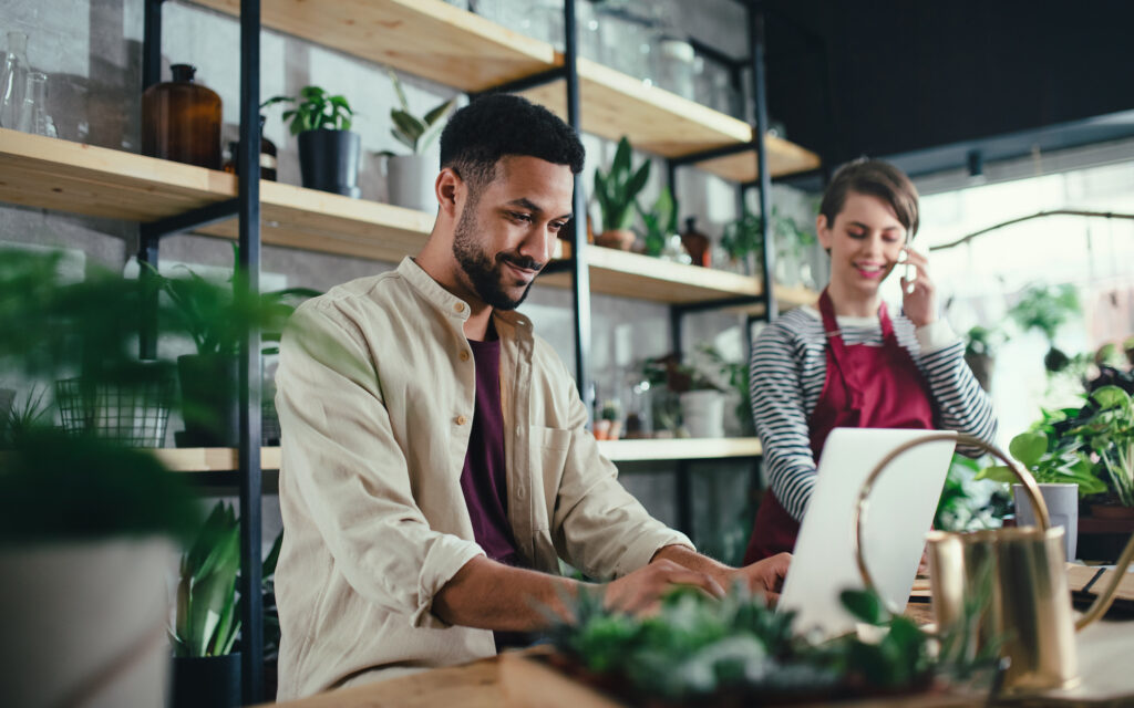 A small business owner in San Diego looking for tax planning tips on his laptop